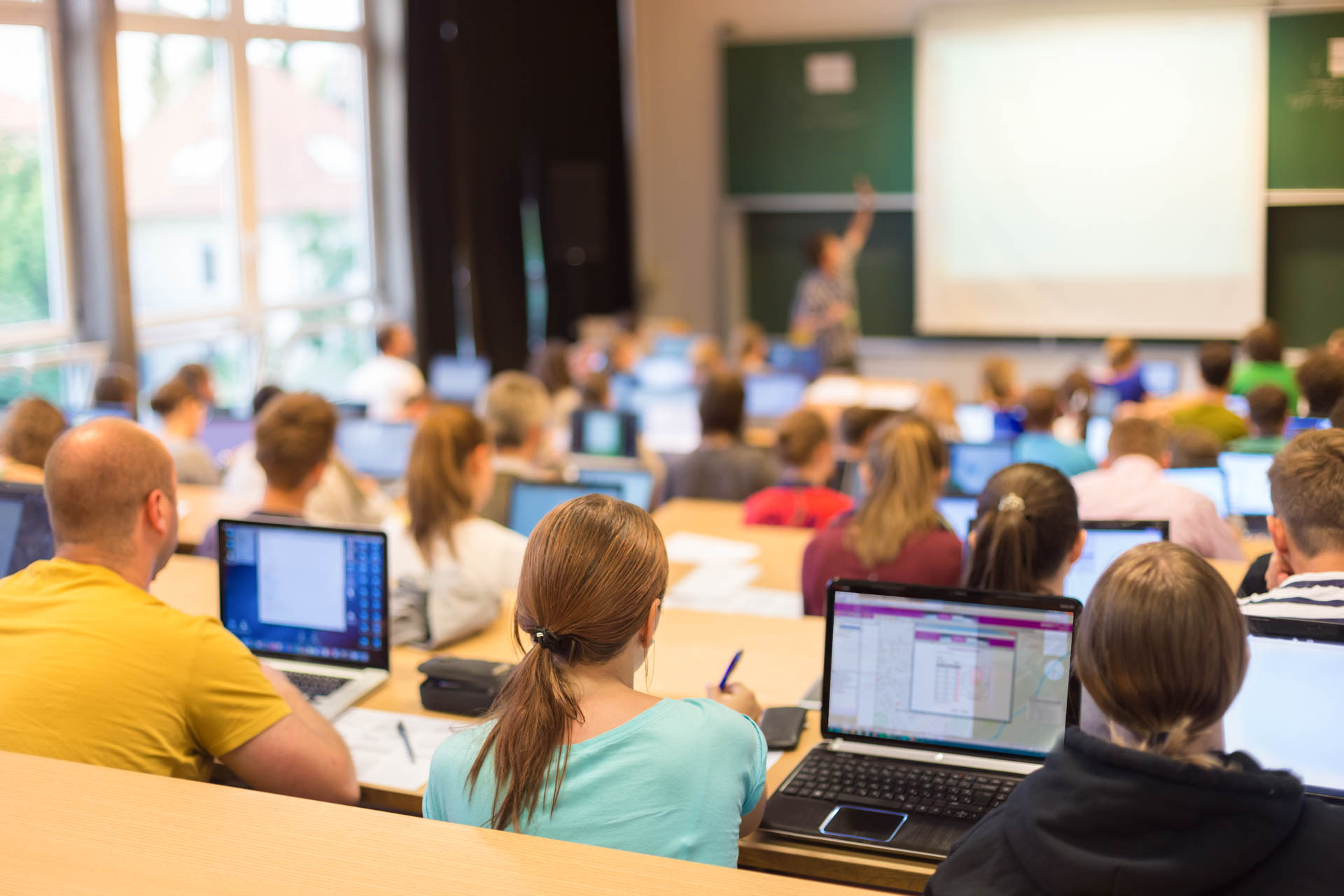 Class Of University Students Using Laptops In Lecture